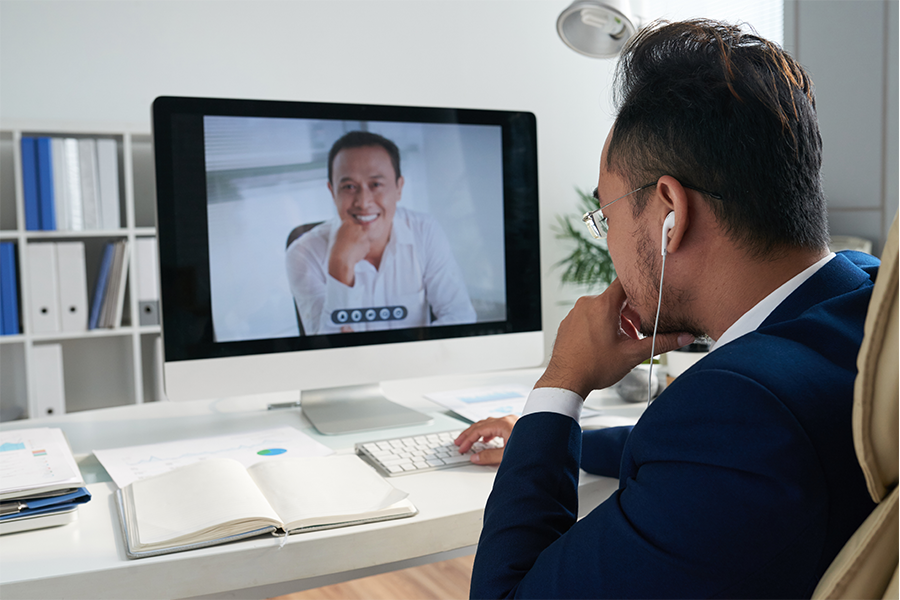 Employee talks over video call in an office
