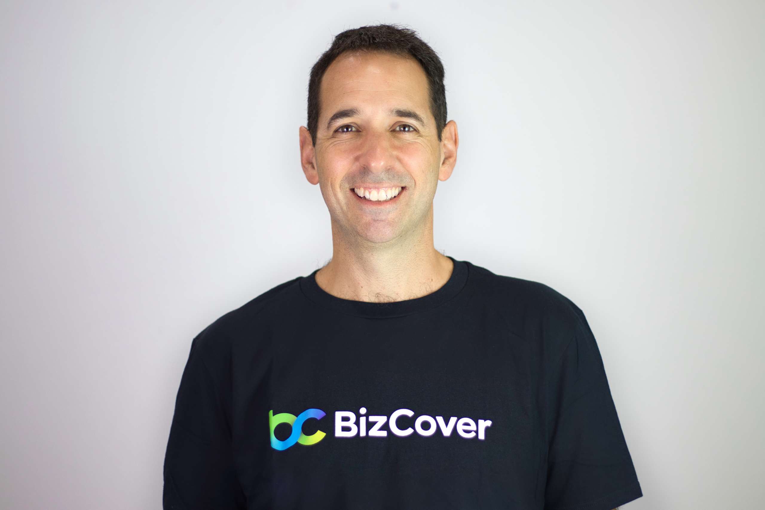 Smiling Michael Gottlieb wearing BizCover shirt