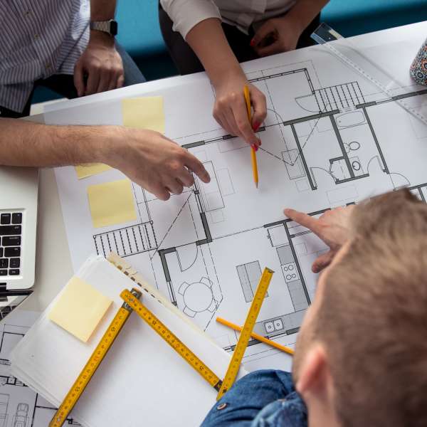 Architects working on a building plans.
