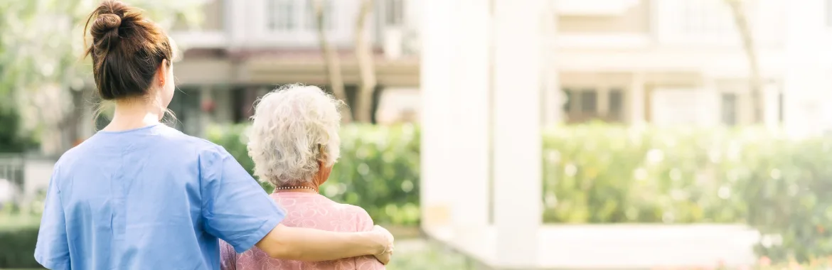 A support worker assists an aged care patient
