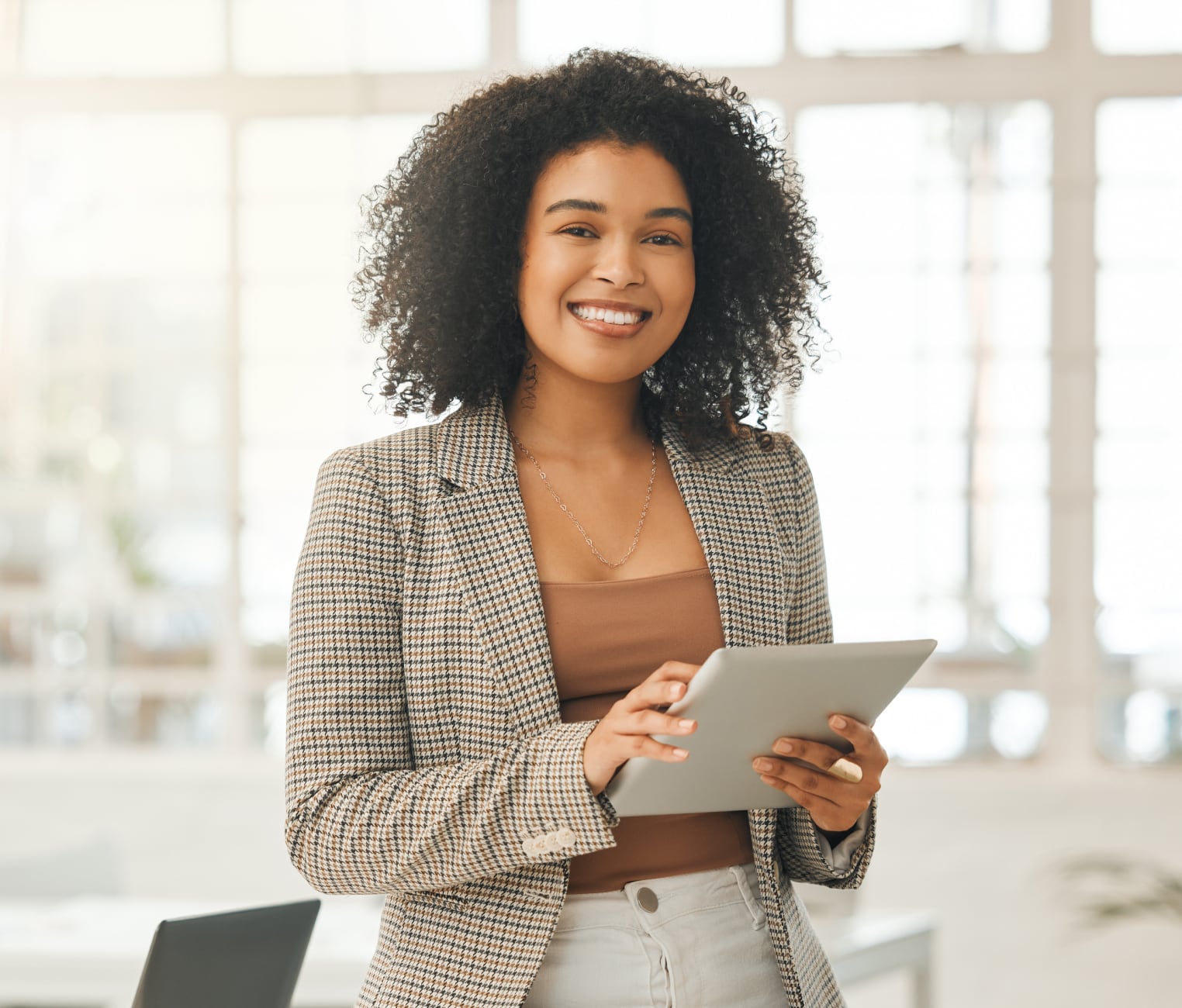 A happy design professional working with a tablet computer