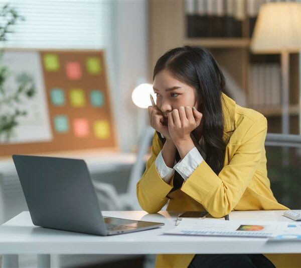 A businesswoman looking at a laptop