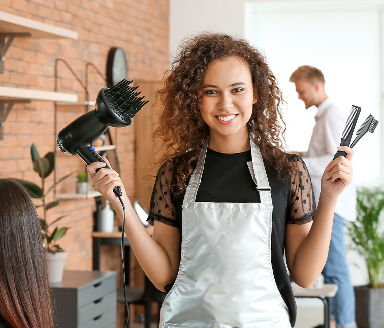 A hairdresser and beautician with beauty products