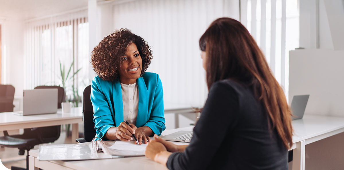 A consultant with a client in office.