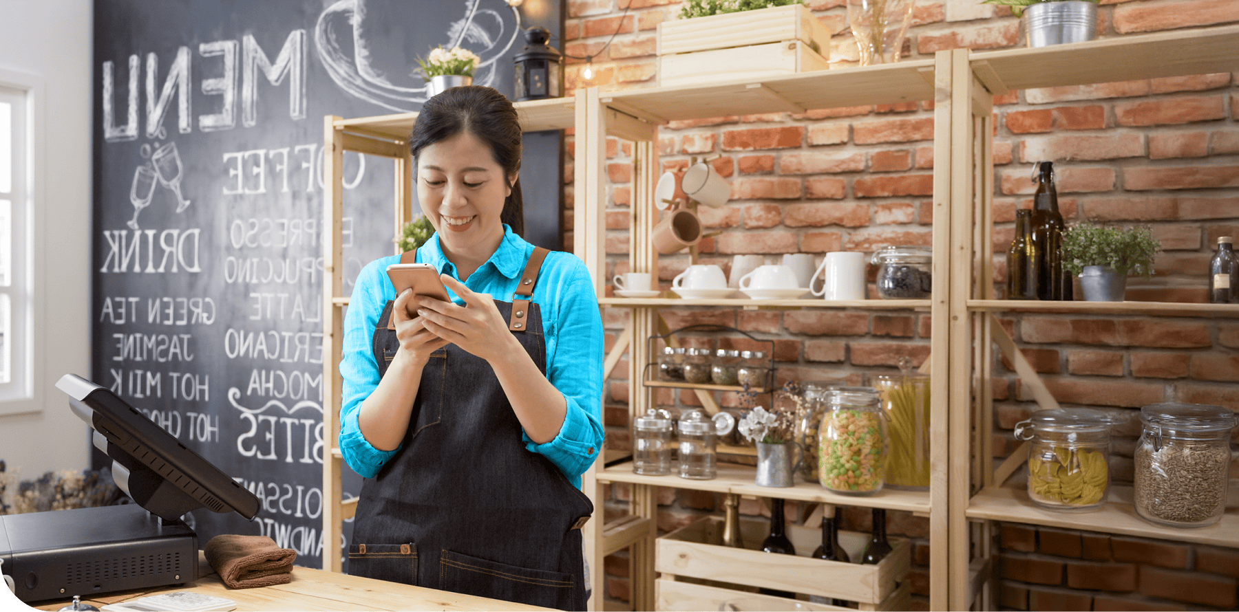 A food / hospitality business owner checks her phone