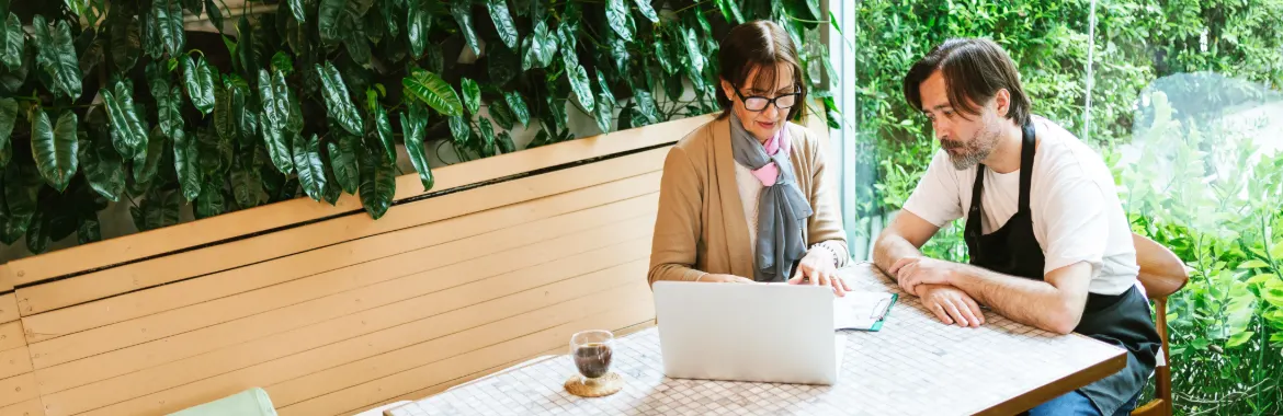 Two business persons discussing about a business insurance strategy