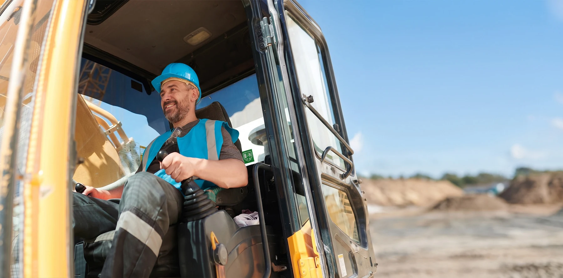 A heavy machinery operator operates / transports equipment