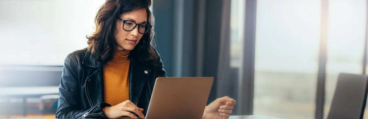 A professional business women working on her laptop