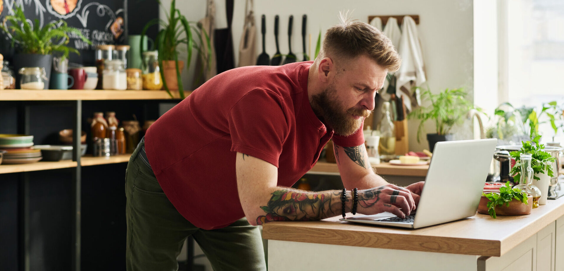 Young home business owner in loft kitchen at home