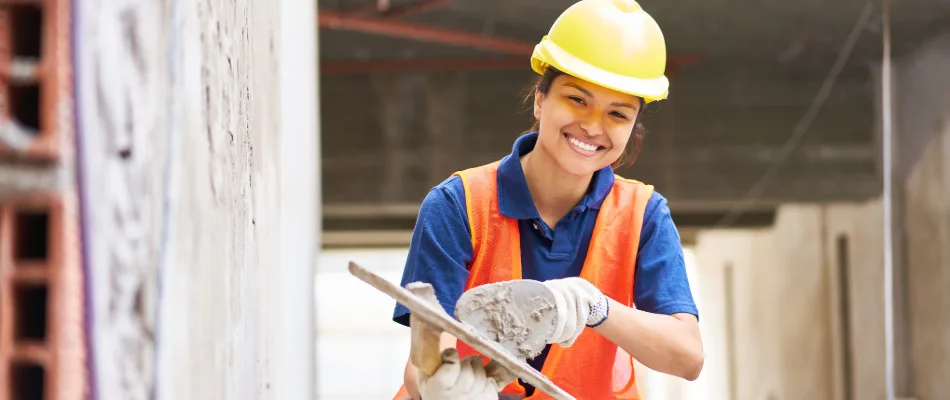 A construction tradie working with concrete