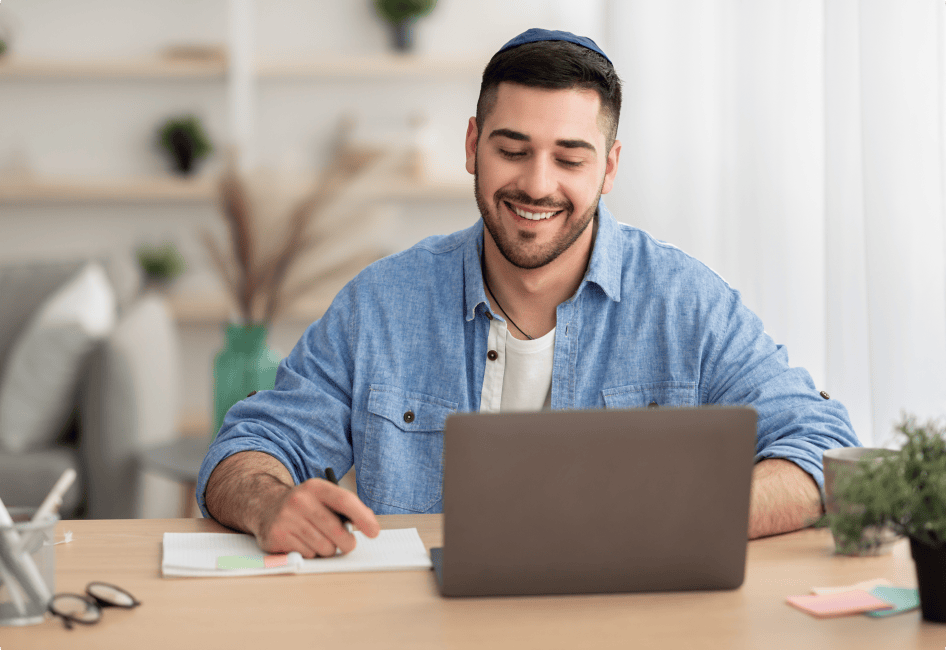An IT consultant with a laptop at his work.