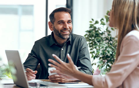 A consultant and client in conversation, sharing ideas